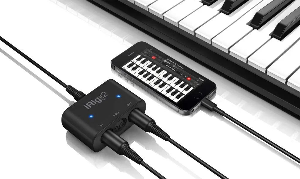 IK Multimedia iRig MIDI 2 universal MIDI interface with In, Out, and THRU ports, activity indicators for iPhone, iPad, Android, Mac, PC